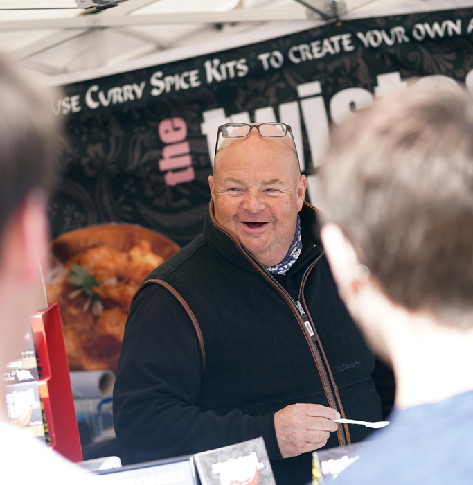 Happy customers trying curry